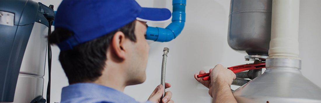 Electrician working on water heater